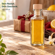 Apotheker eckig 100 ml gefüllt als selbstgemachtes Geschenk in warmem Wohnambiente; 12er-Set mit gravierten Holzgriffkorken.